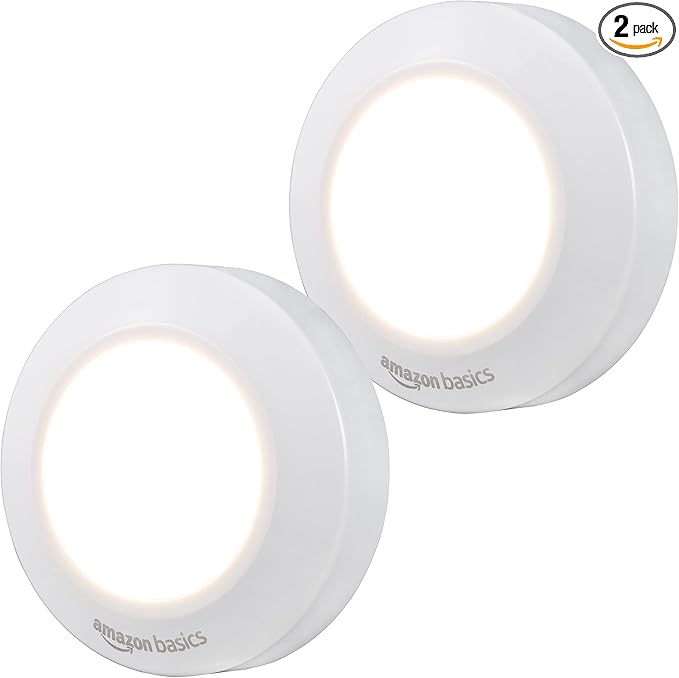 Amazon Basics LED Puck Lights, Battery Operated, 50 Lumens 2 Pack, Tap Light, Stick on Lights, Under Cabinet Lighting, Ideal for Kitchen Cabinets, Closets, Garage and More, White